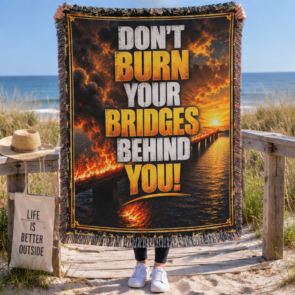 Don’t Burn Your Bridges Behind You woven blanket with fiery bridge artwork, bold motivational typography and decorative fringe.