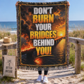 Don’t Burn Your Bridges Behind You woven blanket with fiery bridge artwork, bold motivational typography and decorative fringe.
