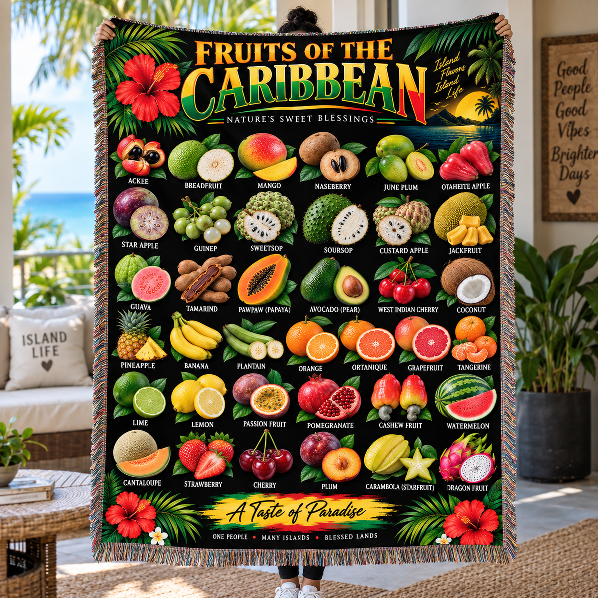 Black Caribbean-inspired woven blanket featuring colorful tropical fruits including ackee, breadfruit, mango, soursop, guinep, coconut, pineapple and other island fruits with tropical flowers and Fruits of the Caribbean lettering.